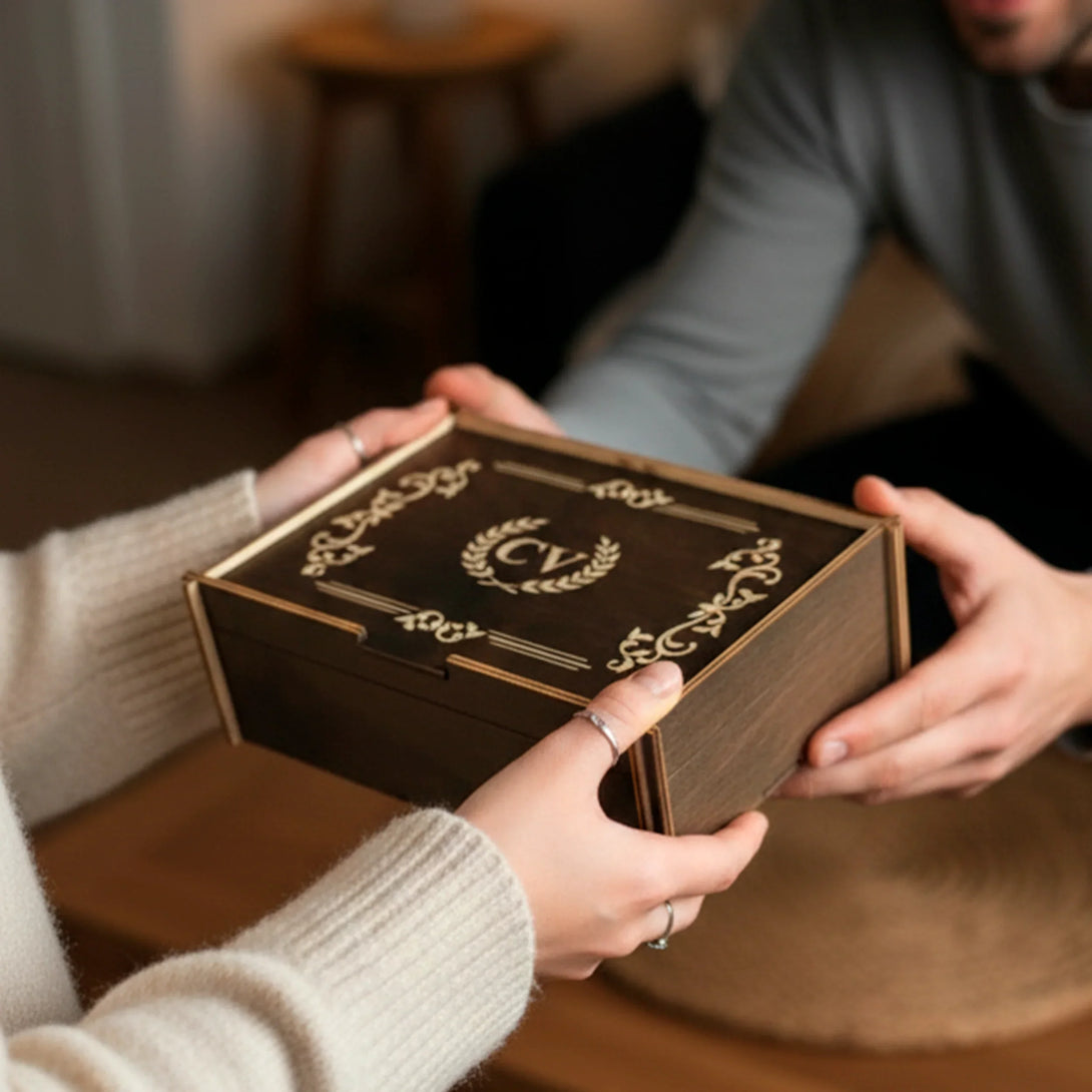 Personalized leather wallet and belt gift set for men in decorative wooden box being handed over